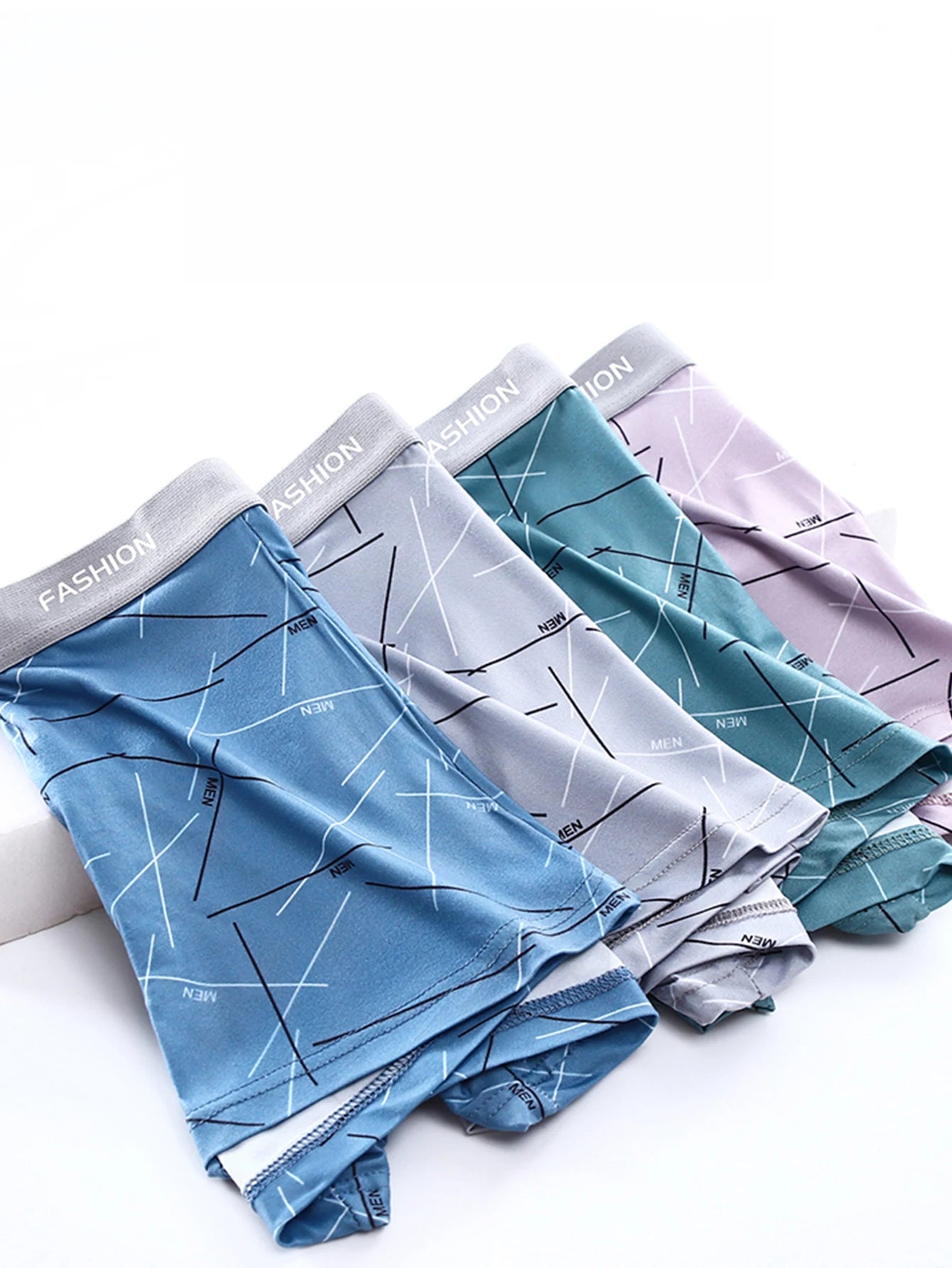 LuckeLadybug LLC men's boxer briefs set in blue, gray, teal, and lavender with stylish patterns