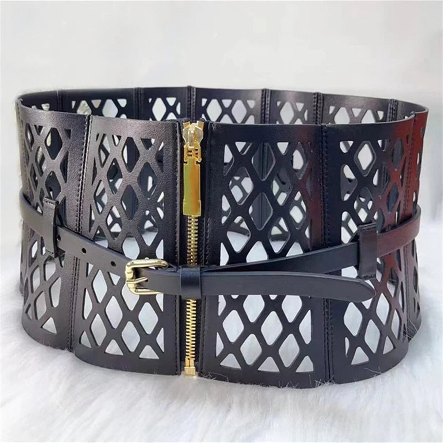 Black waist cinching mini dress for women with stylish cut-out design and adjustable buckle closure