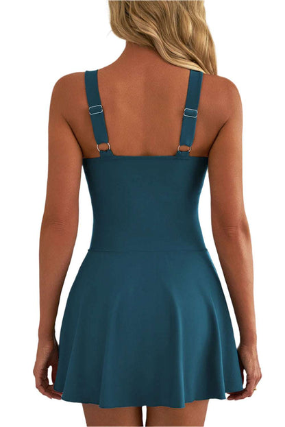 Back view of a fashionable one piece swim dress in teal blue by LuckeLadybug LLC with adjustable straps
