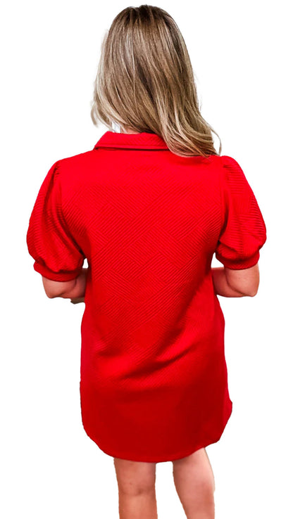 Back view of a LuckeLadybug fiery red mini dress with puff sleeves and a stylish collar