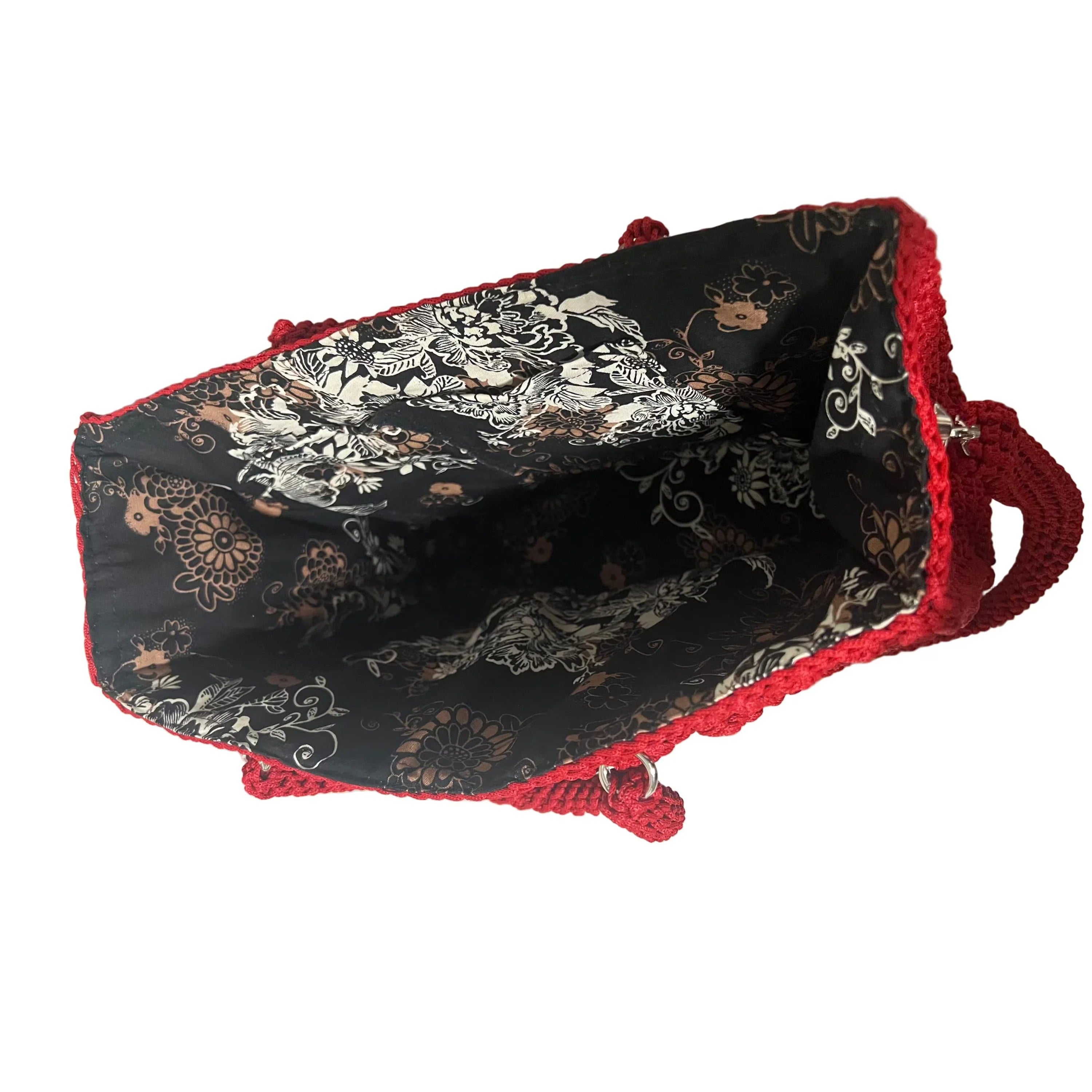 Interior view of the Flame Frame Structured Red Trapezoid Bag featuring a stylish floral lining
