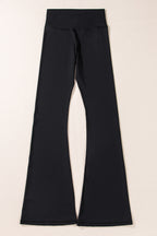 Black flared leggings by LuckeLAdybug LLC with a high waistband for comfort and style