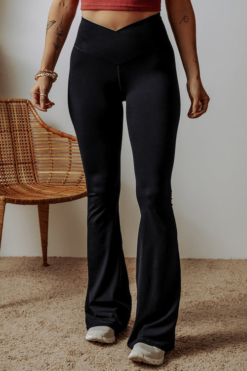 Black flared leggings from LuckeLadybug LLC featuring a high waist design for a flattering fit