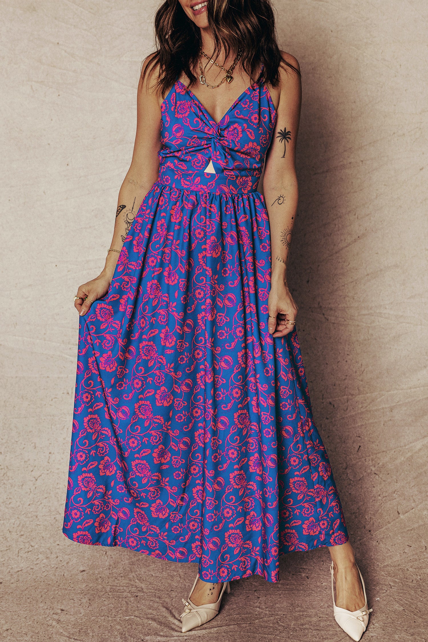 Vibrant floral fit and flare maxi dress from LuckeLadybug LLC with a stylish knot detail