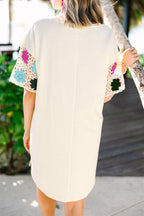 LuckeLadybug LLC Floral dress dress with colorful crochet sleeves in a light fabric