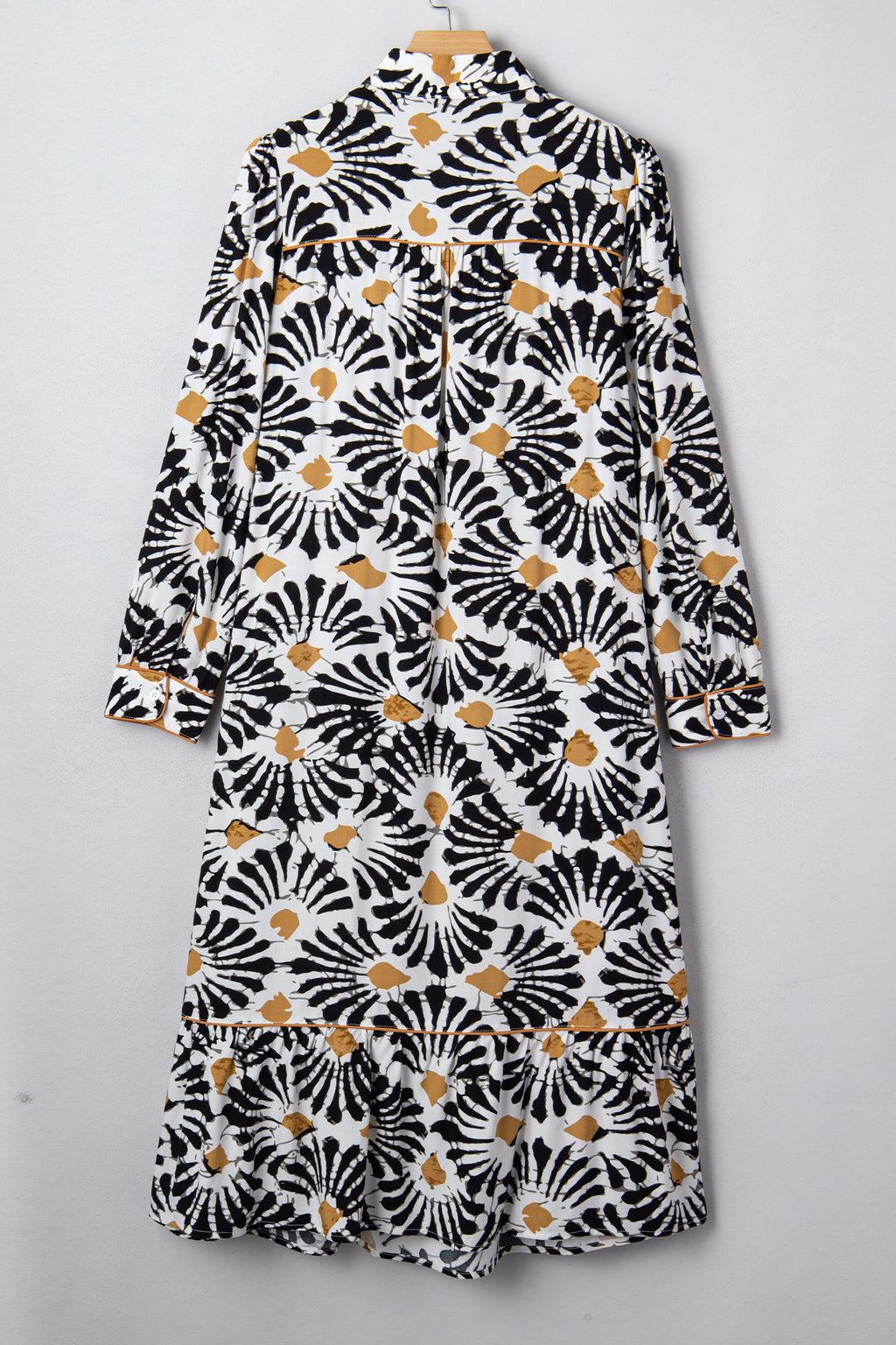 LuckeLadybug LLC Floral dress dress in black and white with a ruffled hem and long sleeves