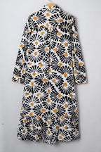 LuckeLadybug LLC Floral dress dress in black and white with a ruffled hem and long sleeves
