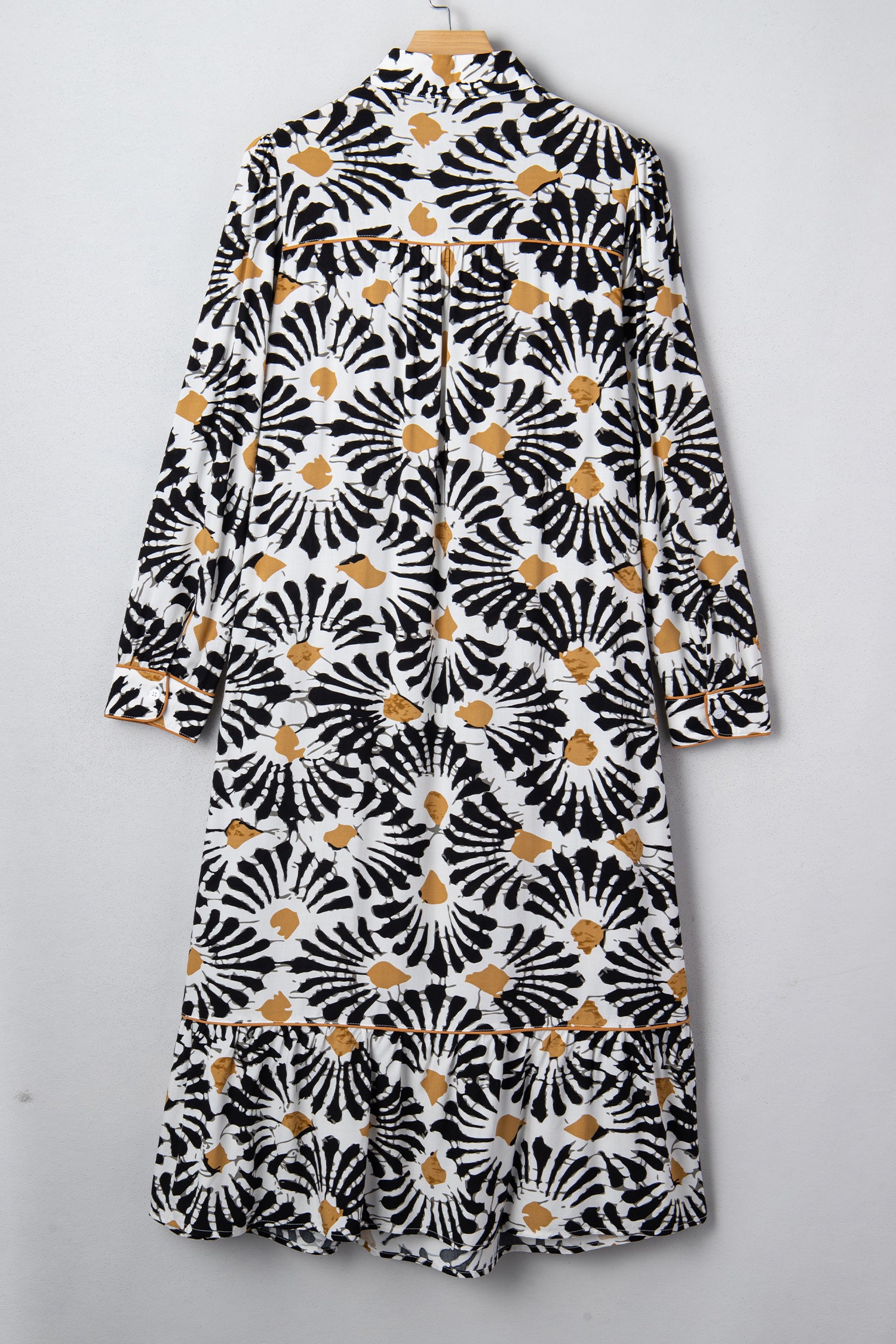 LuckeLadybug LLC Floral dress dress in black and white with a ruffled hem and long sleeves