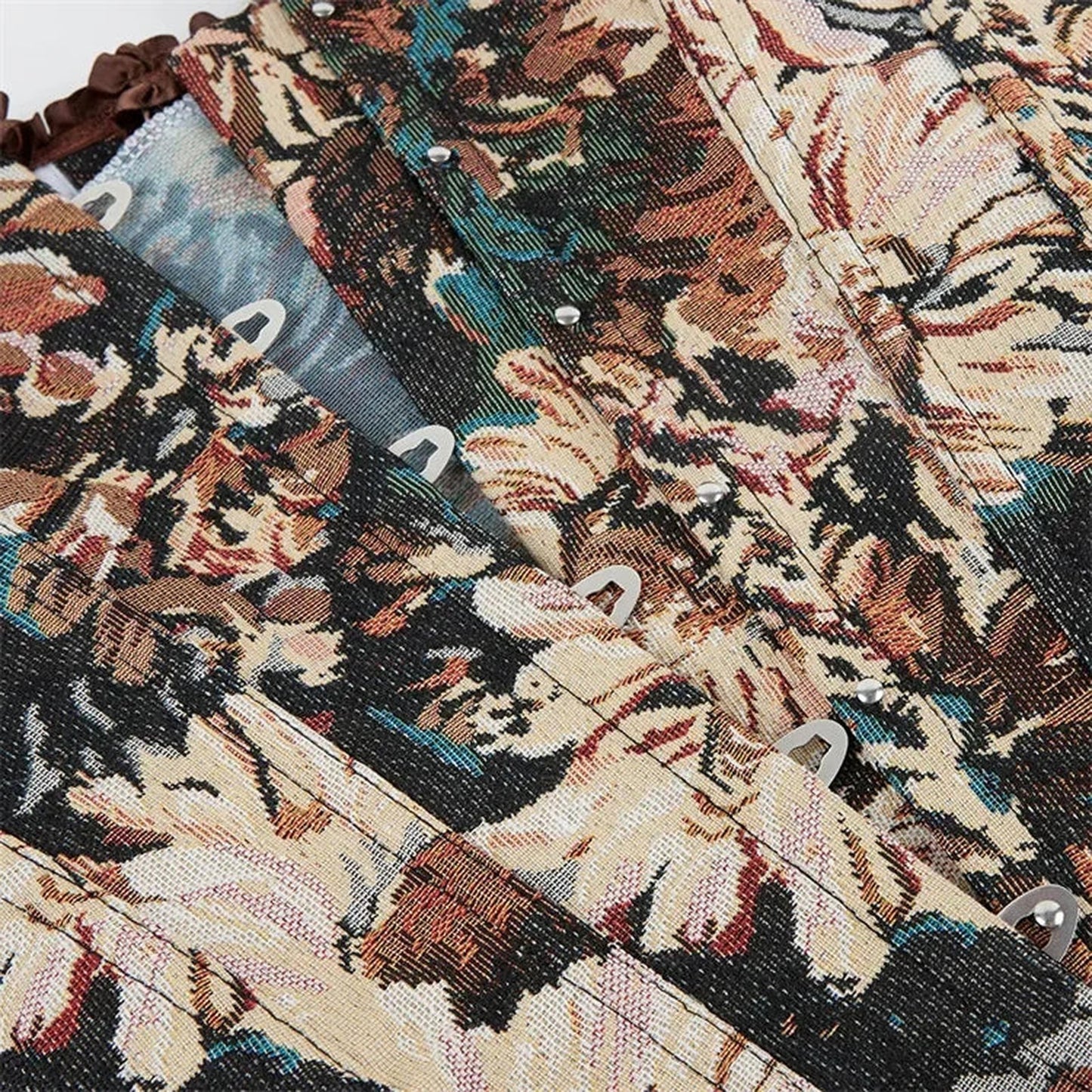 Floral gothic corset top featuring intricate floral patterns and lace-up design for a stylish look