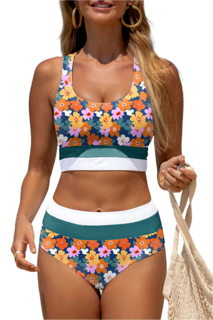 Floral racerback bikini for women with vibrant orange and pink flowers and green and white bands