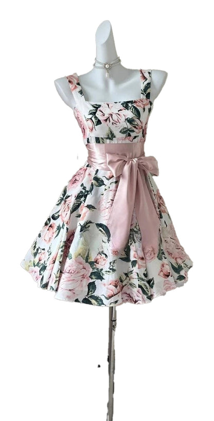 Floral sleeveless mini dress for women with a fitted bodice and elegant sash belt