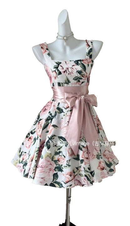 Floral sleeveless mini dress for women with a pink sash and elegant floral pattern