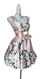 Floral sleeveless mini dress for women with a fitted bodice and pink satin belt detail