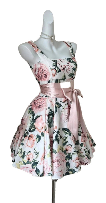 Floral sleeveless mini dress for women with a fitted bodice and pink satin belt detail