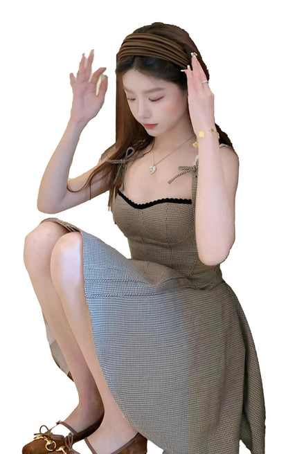 Chic French style khaki mini dress with adjustable straps and a flared silhouette for a fashionable look