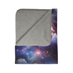 Galaxy sherpa blanket with soft gray fleece lining and vibrant space-themed design