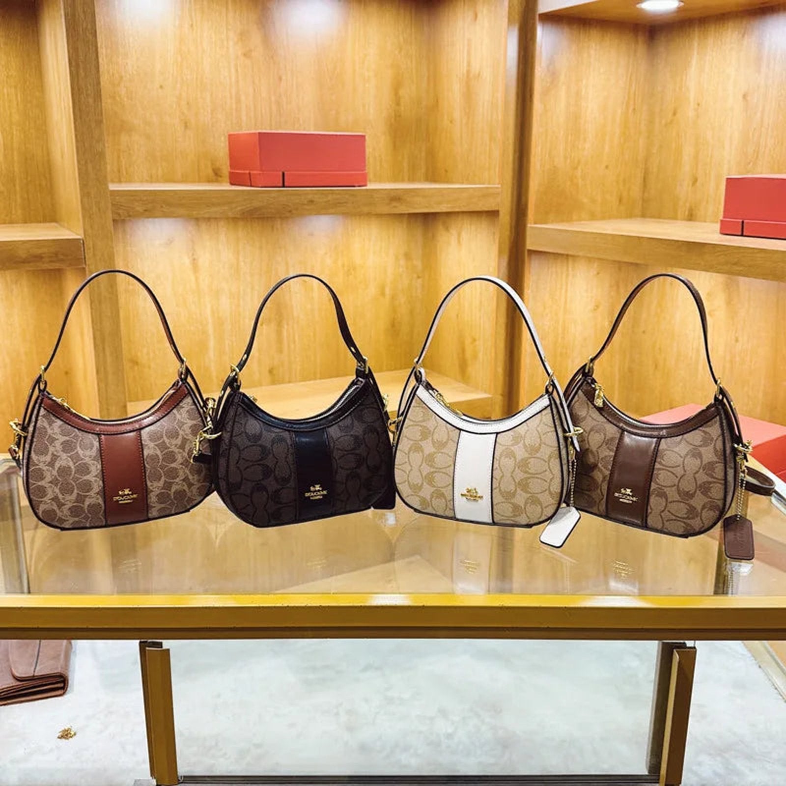 Collection of geometric pattern women's hobo bags in various colors displayed on a shelf