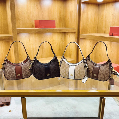 Collection of geometric pattern women's hobo bags in various colors displayed on a shelf