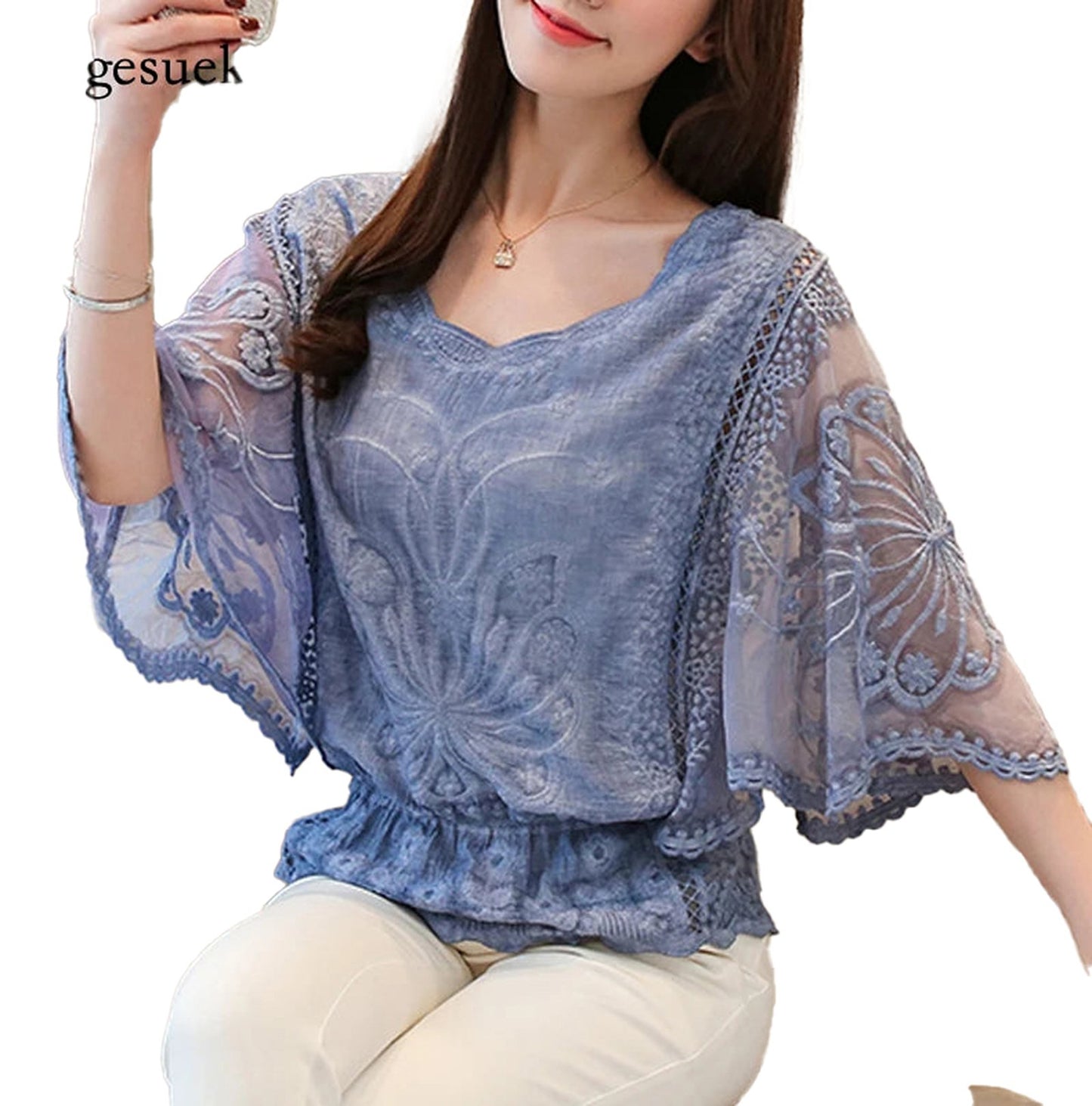 Elegant butterfly flower blouse in soft blue with intricate lace detailing and flowing sleeves