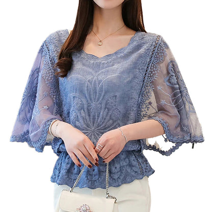 Elegant butterfly flower blouse in blue with delicate embroidery and flowing sleeves