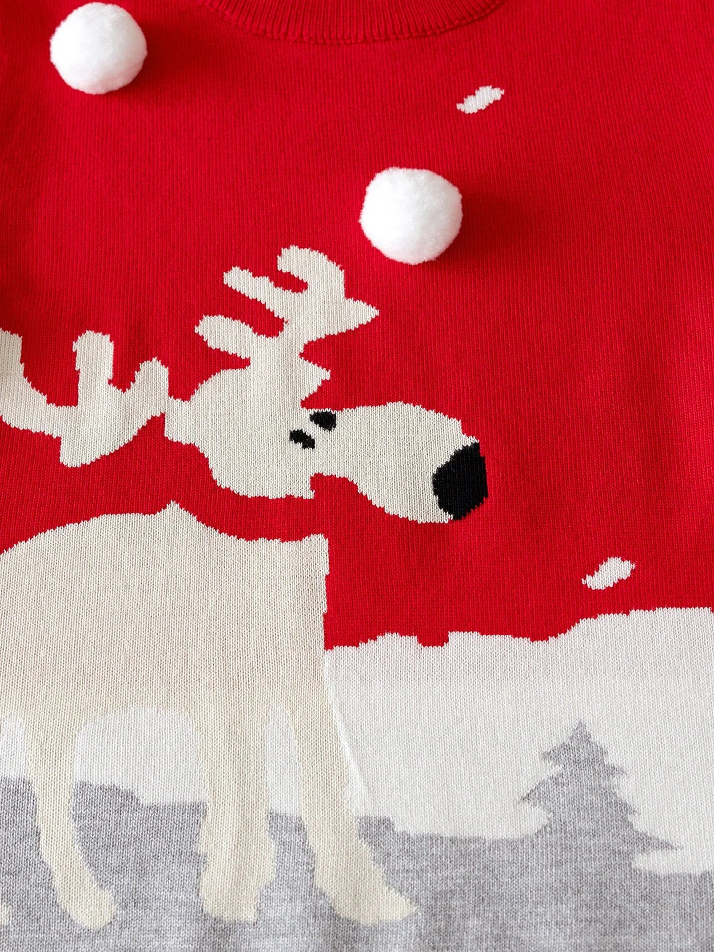 Girls Christmas deer sweater in red and gray featuring a playful reindeer design and pom-pom accents