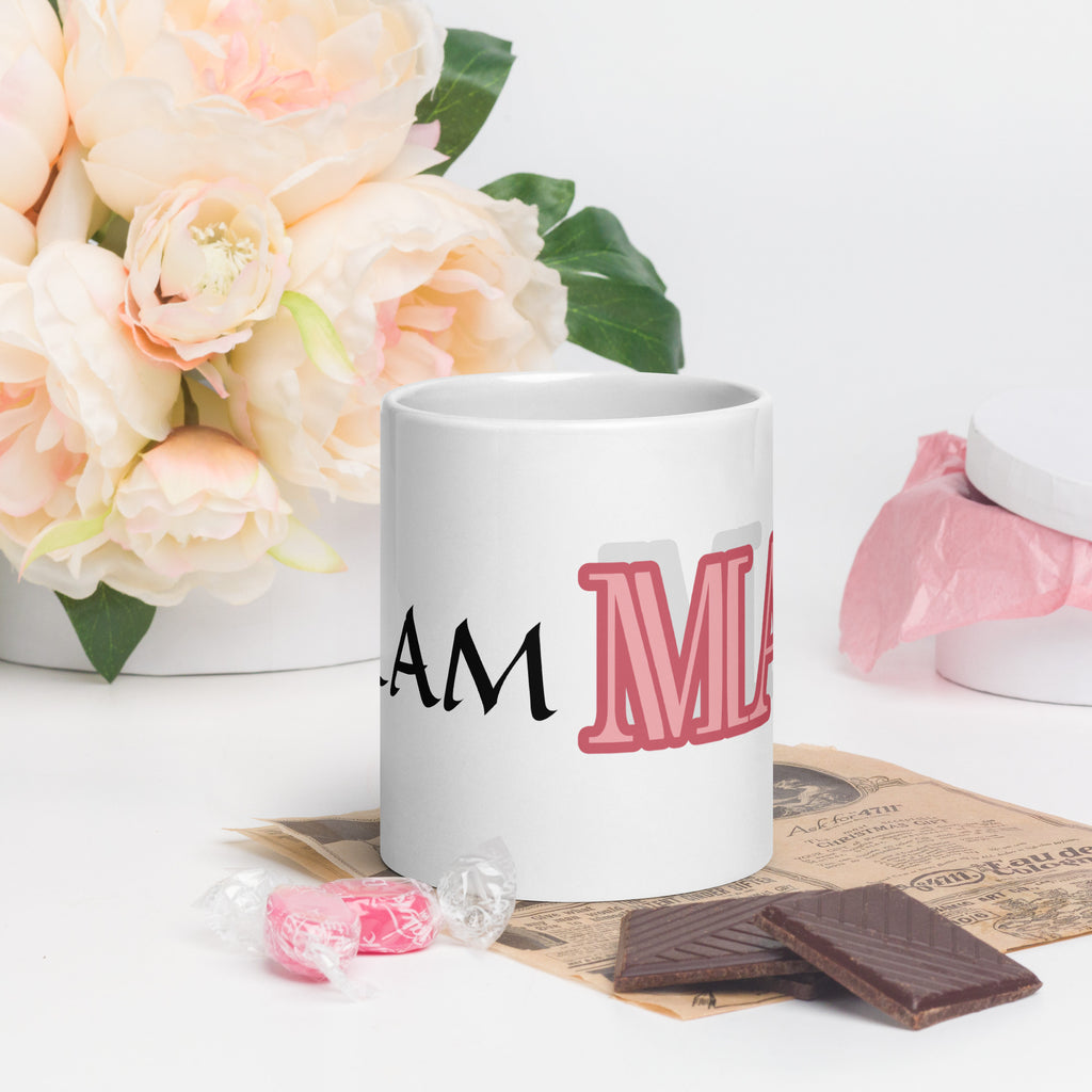LuckeLadybug glam ma coffee mug with bold pink and black text next to flowers and chocolate pieces