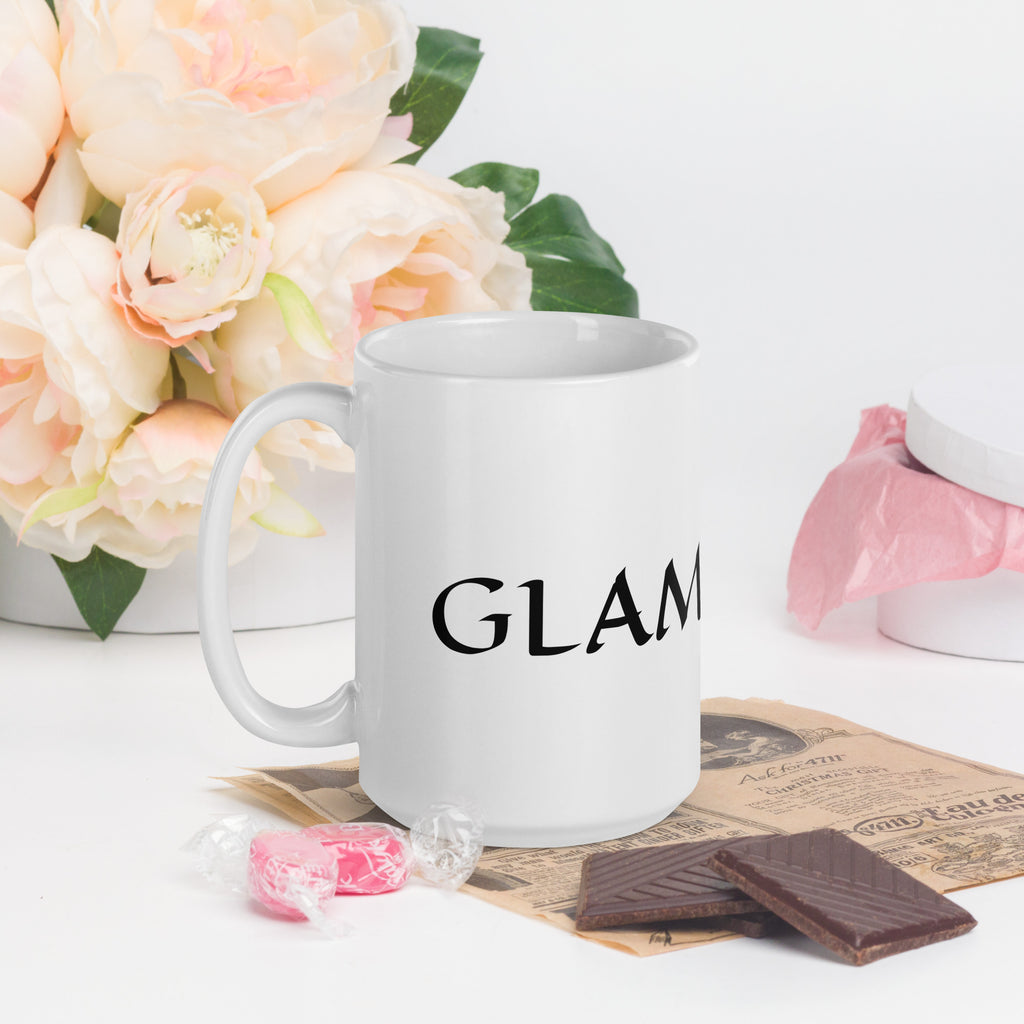 White ceramic glam ma coffee mug by LuckeLadybug with black text surrounded by flowers and chocolates