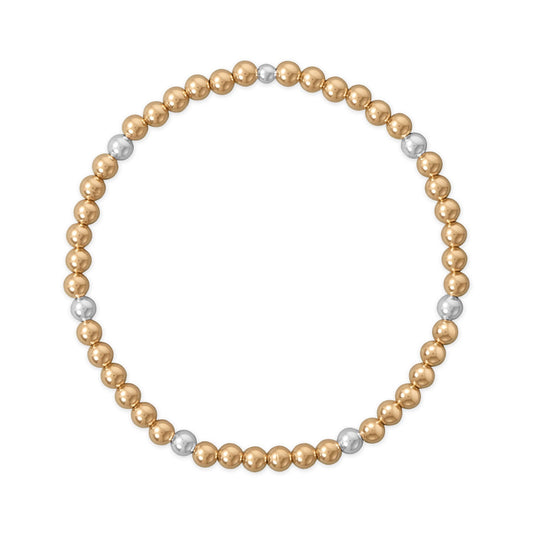 Gold filled and silver bead stretch bracelet featuring alternating gold and silver beads for a stylish look