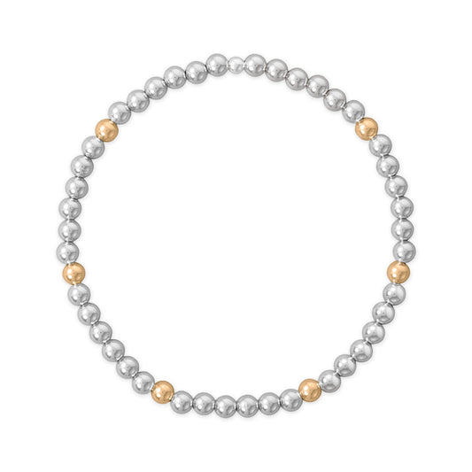 Gold filled and silver bead stretch bracelet featuring alternating silver and gold beads for elegant accessorizing