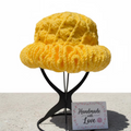 Golden Horizon Wavy Brim Crochet Hat in bright yellow with a unique ruffle design, handmade with love