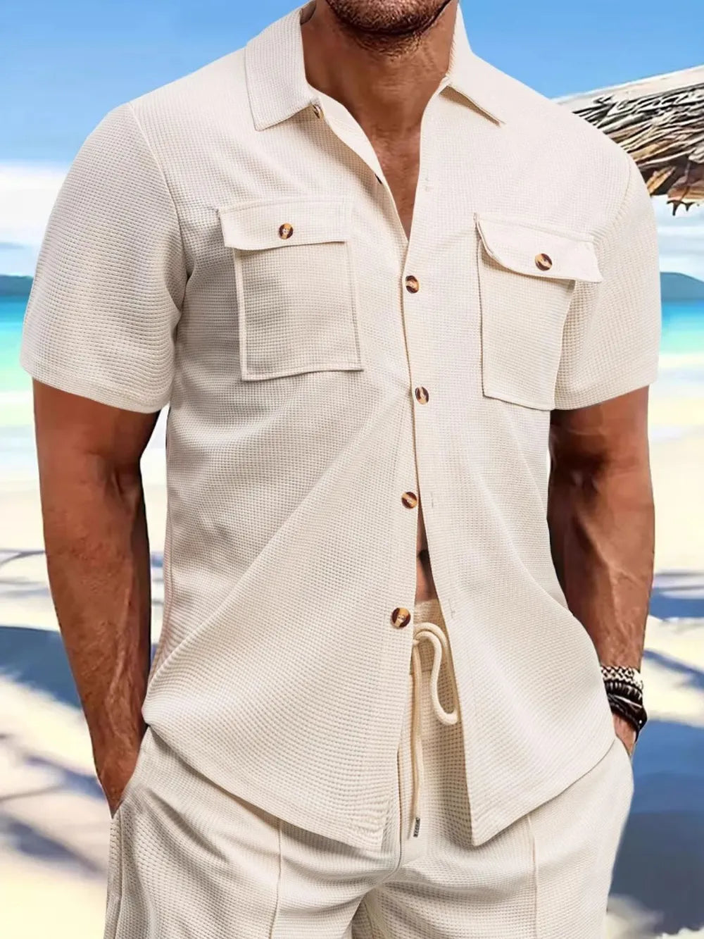 Men's button-up shirt in cream color with front pockets, perfect for casual summer outings