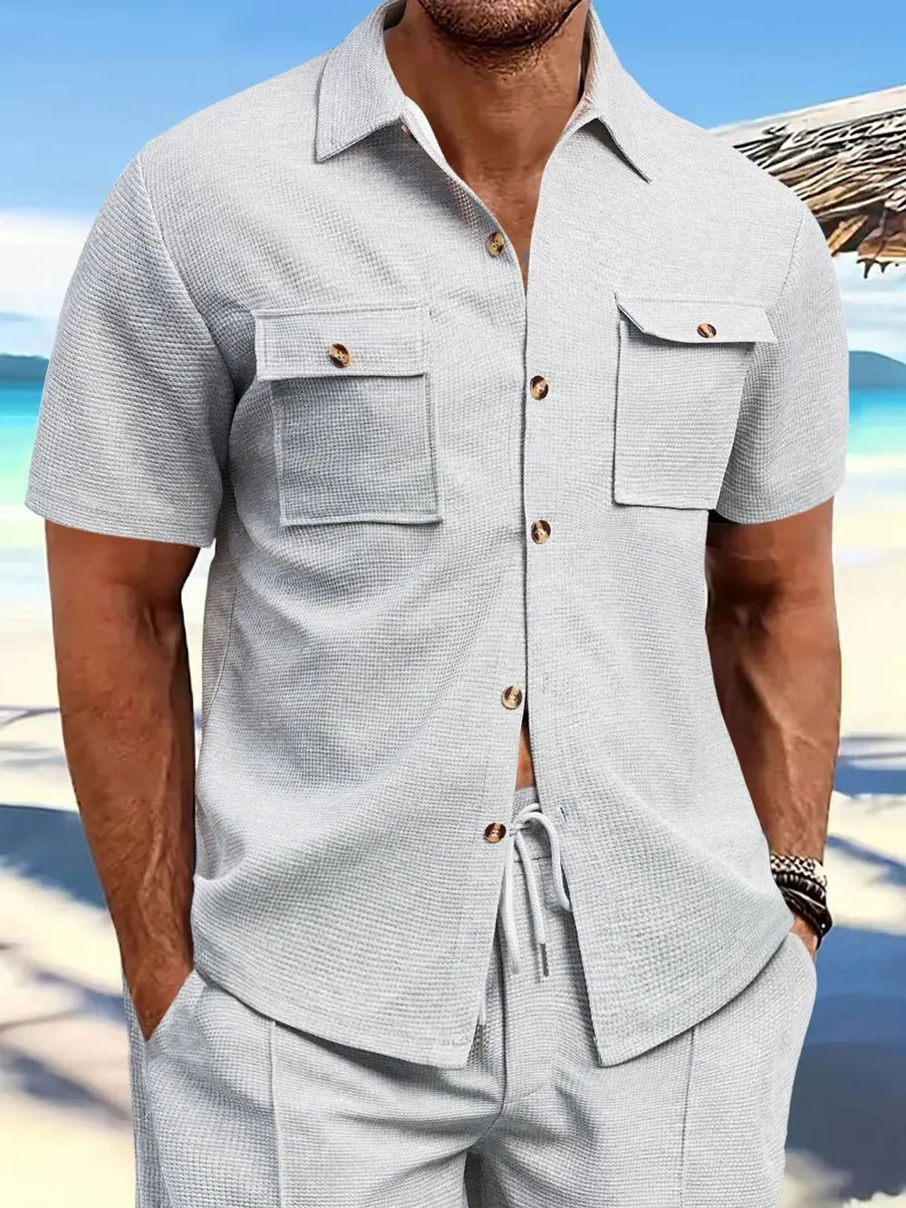 Light grey button up shirt with chest pockets for a casual look, perfect for layering over a graphic men's t shirt