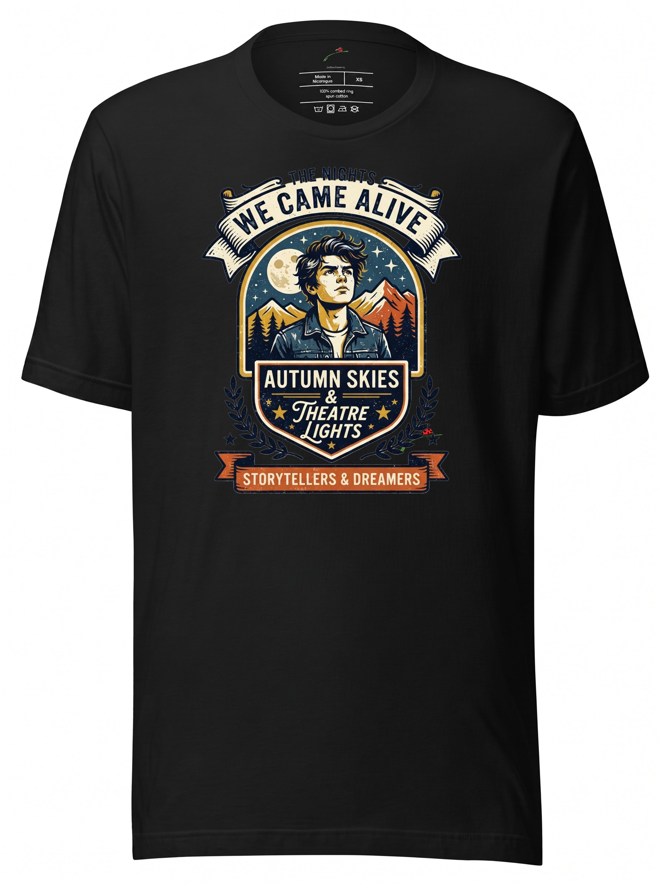 Black graphic tee clothing featuring a vintage design with mountains and a storyteller illustration