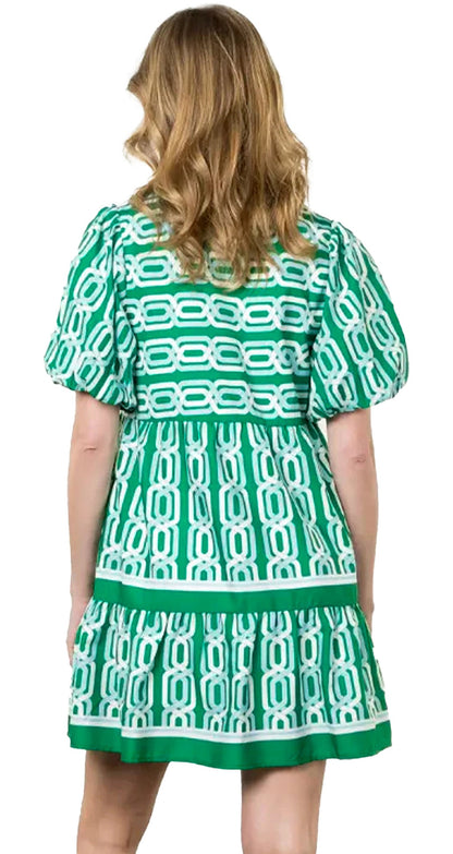 Back view of the LuckeLadybug green abstract mini dress with puffed sleeves and a stylish pattern
