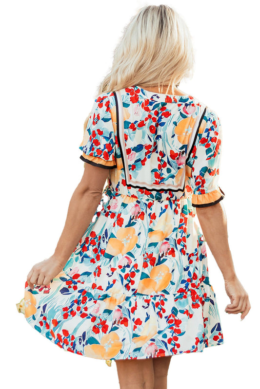LuckeLadybug green floral mini dress featuring vibrant flowers and a flowing skirt perfect for summer outings