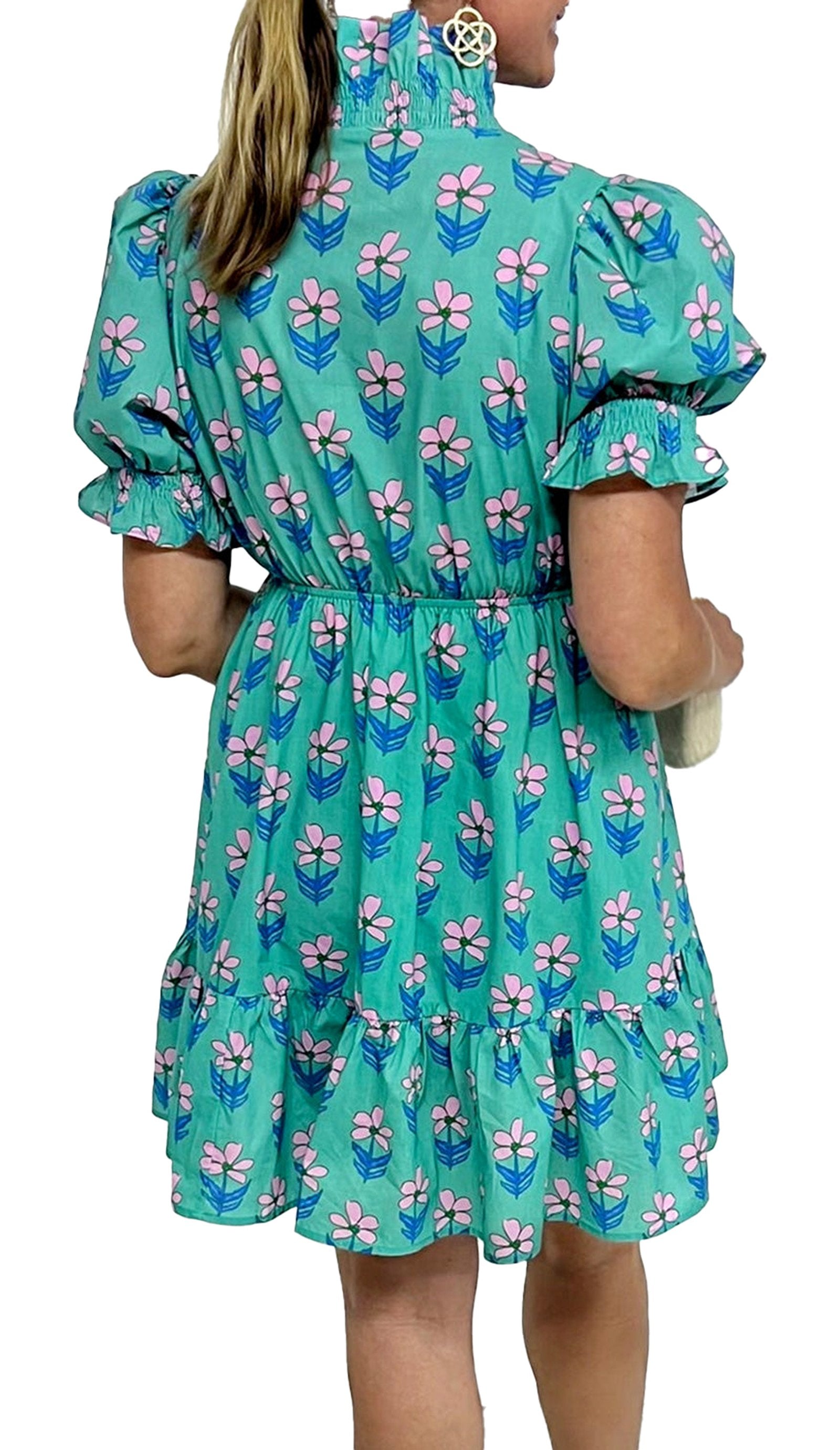 Back view of a LuckeLadybug green floral print mini dress with puff sleeves and ruffled hem
