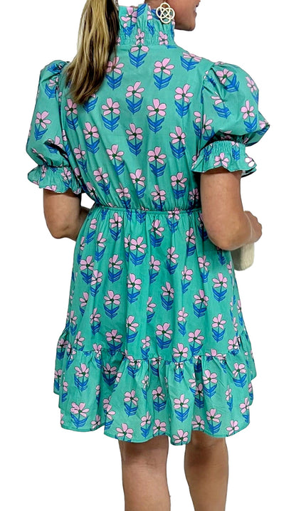 Back view of a LuckeLadybug green floral print mini dress with puff sleeves and ruffled hem