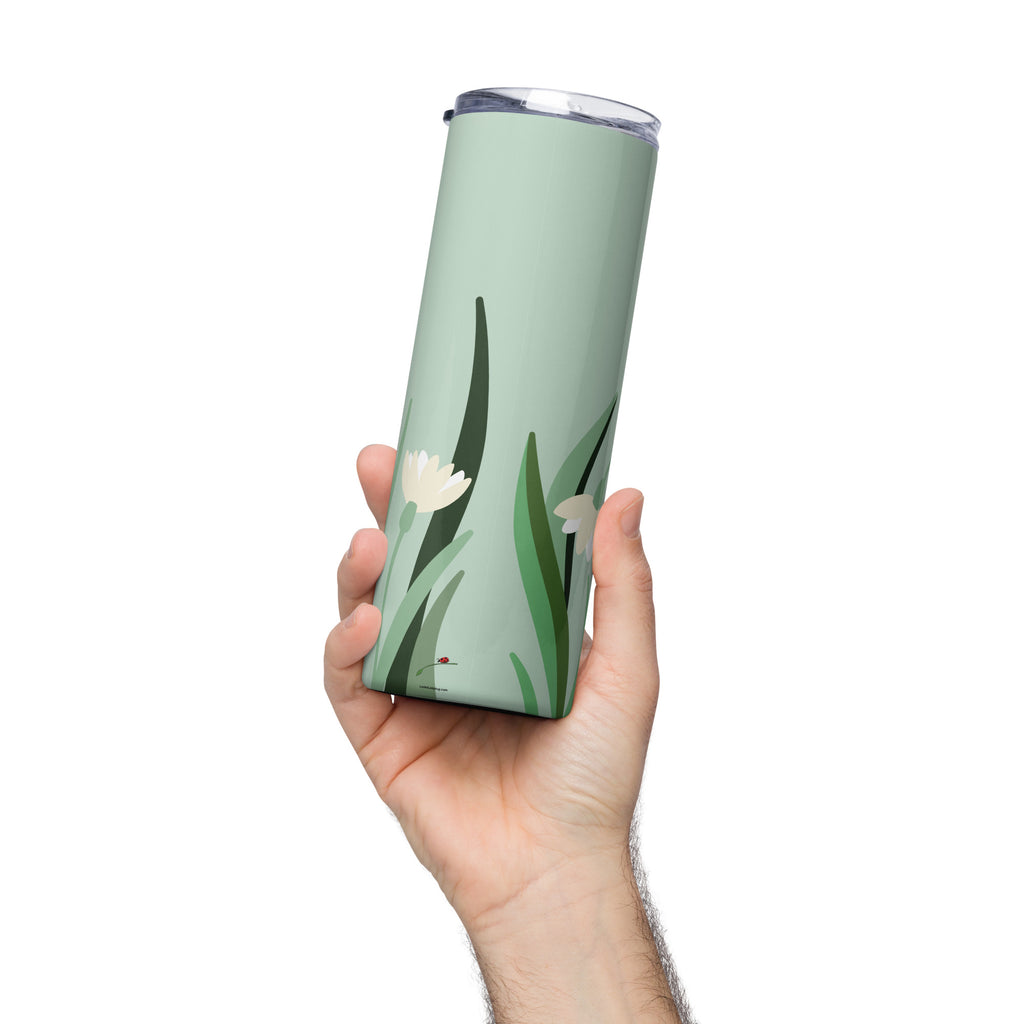 Hand holding green floral stainless steel tumbler with white flowers and leaves design