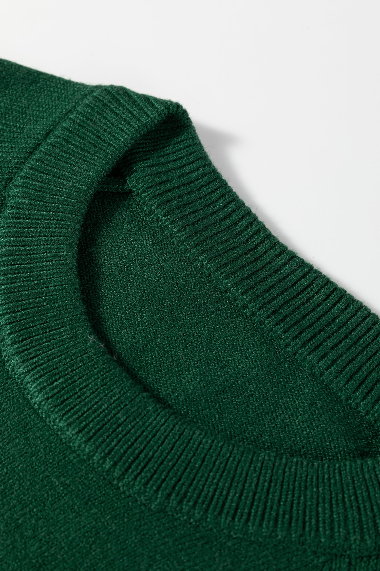 Close-up of a green sweater collar, ideal for pairing with a white MERRY Christmas sweater