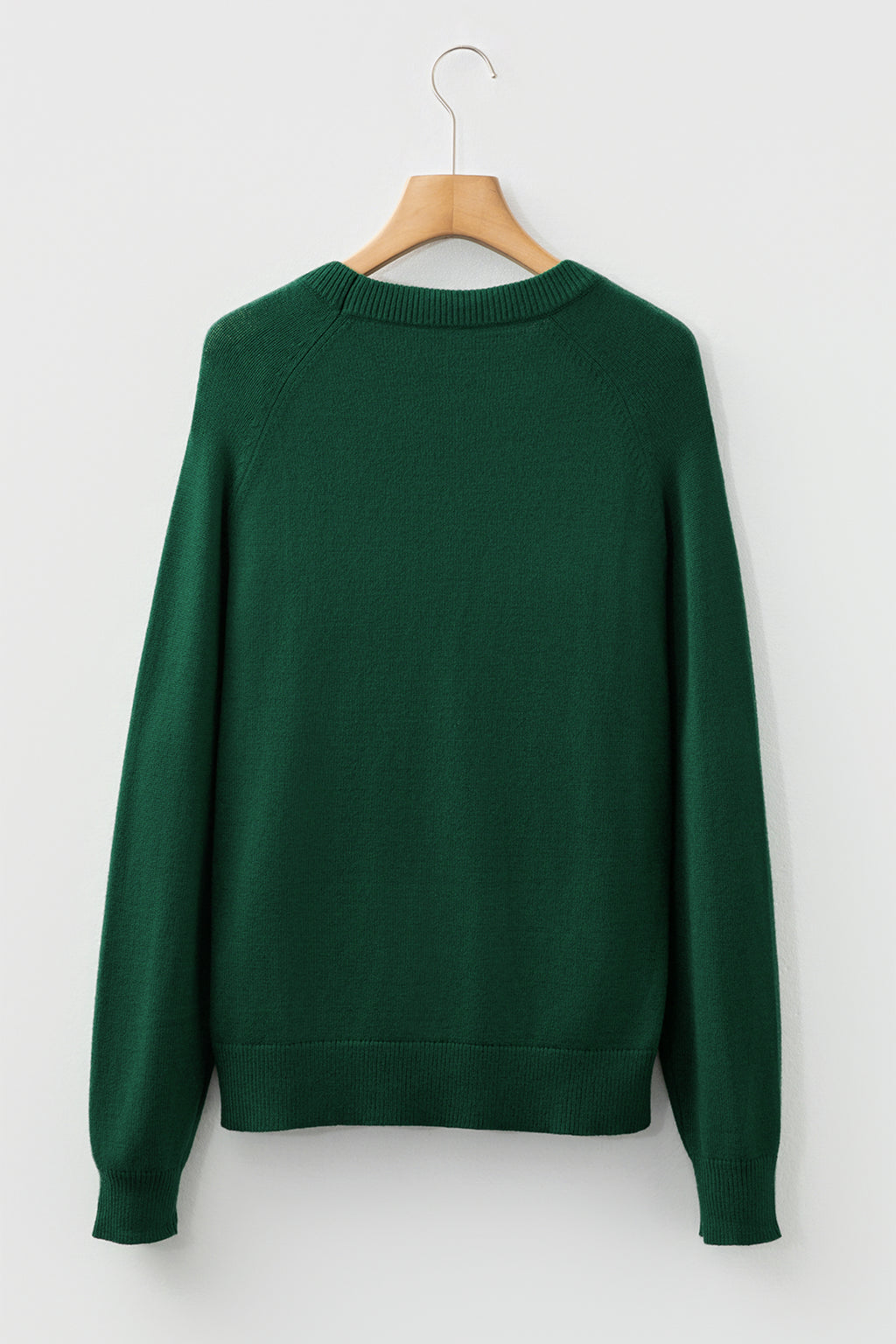 Back view of a green sweater with a cozy fit, ideal for pairing with a white MERRY Christmas sweater