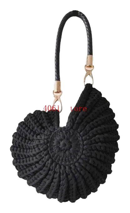 Handwoven seashell clutch bag in black with a stylish braided handle for chic outings