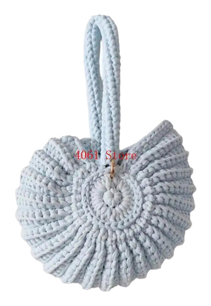 LuckeLadybug LLC handwoven seashell clutch bag in a light blue color with a unique design