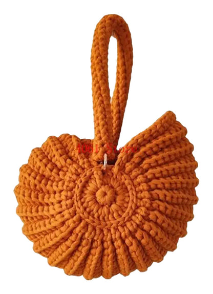 Handwoven seashell clutch bag in vibrant orange for stylish outings and beach days
