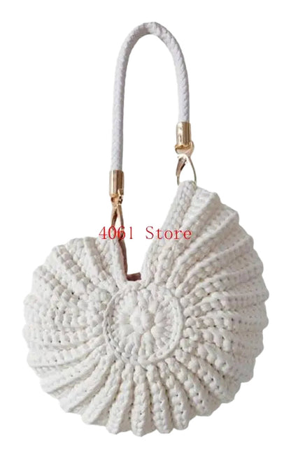 Handwoven seashell clutch bag in white with a unique spiral design and shoulder strap