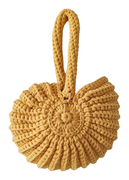 Handwoven seashell clutch bag in yellow with a unique spiral design and sturdy handle