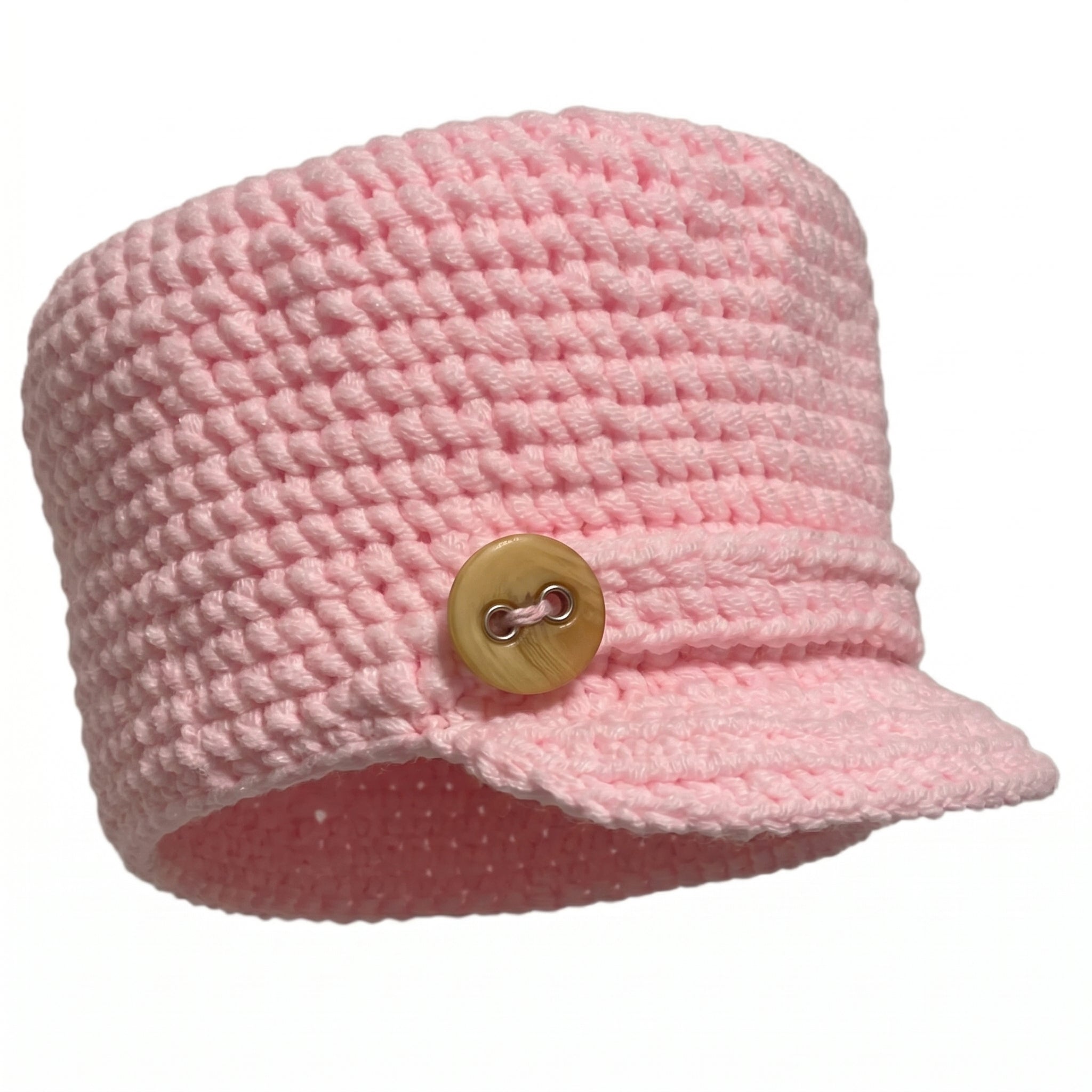 Pink handmade hat with a stylish button on the front, perfect for fashion-forward looks