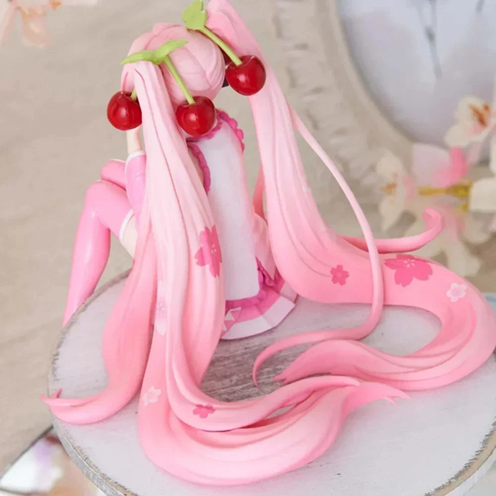 Cute Hatsune and Miku figurine with pink hair and cherry accessories, perfect for anime collectors