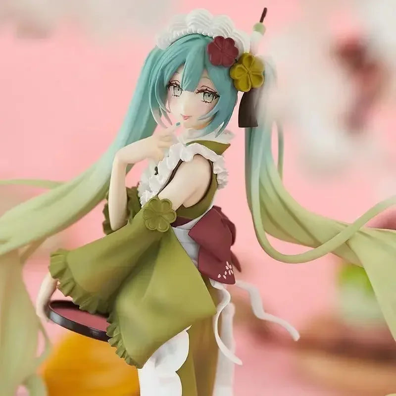 Hatsune and Miku figurine with long hair and floral accessories, showcasing a playful stance and vibrant colors