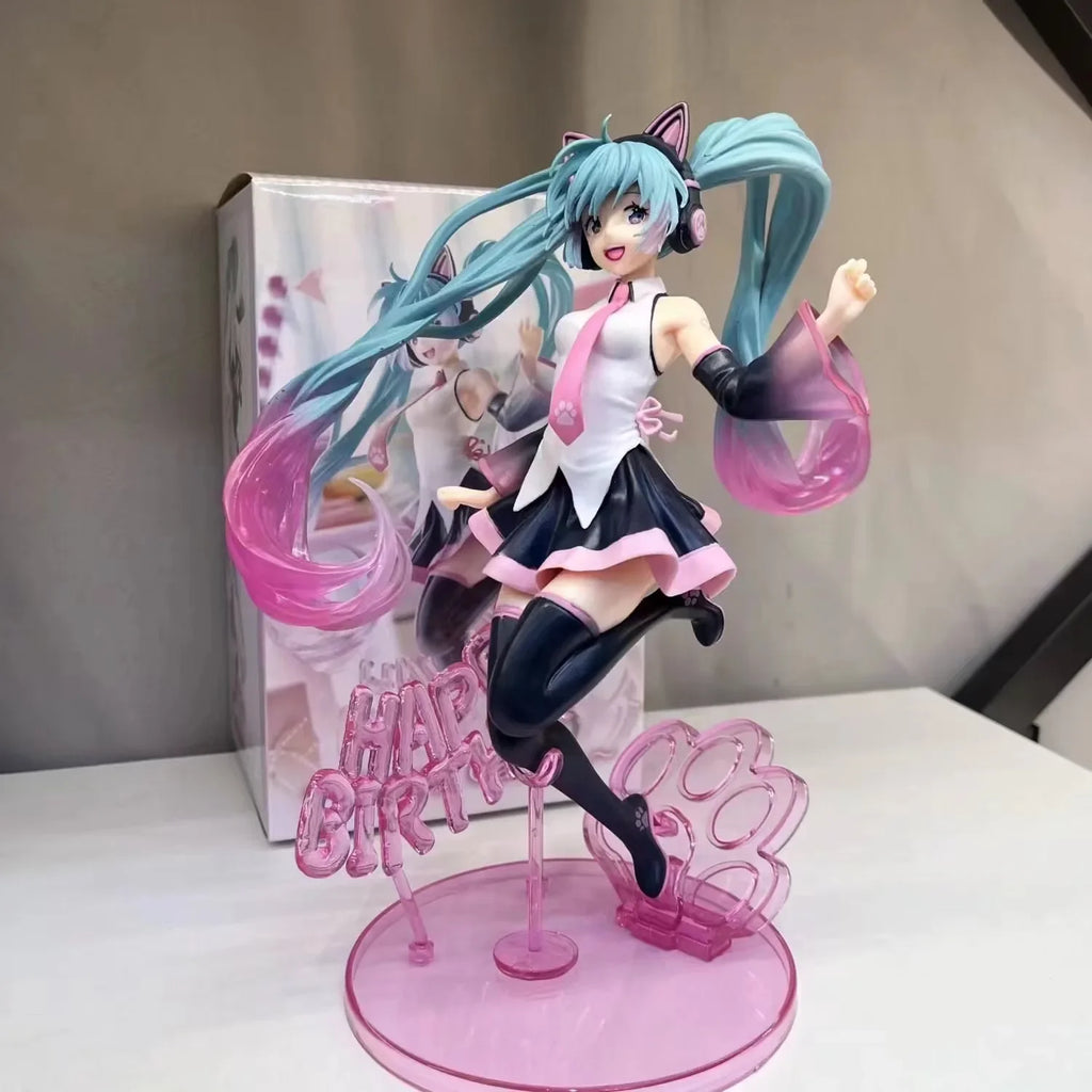 Hatsune and Miku figurine in a festive pose, holding a birthday sign with vibrant colors and details