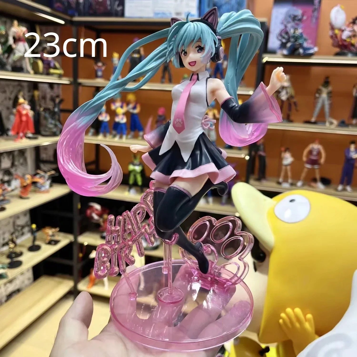 Hatsune and Miku 23cm figurine celebrating a birthday with vibrant colors and playful pose